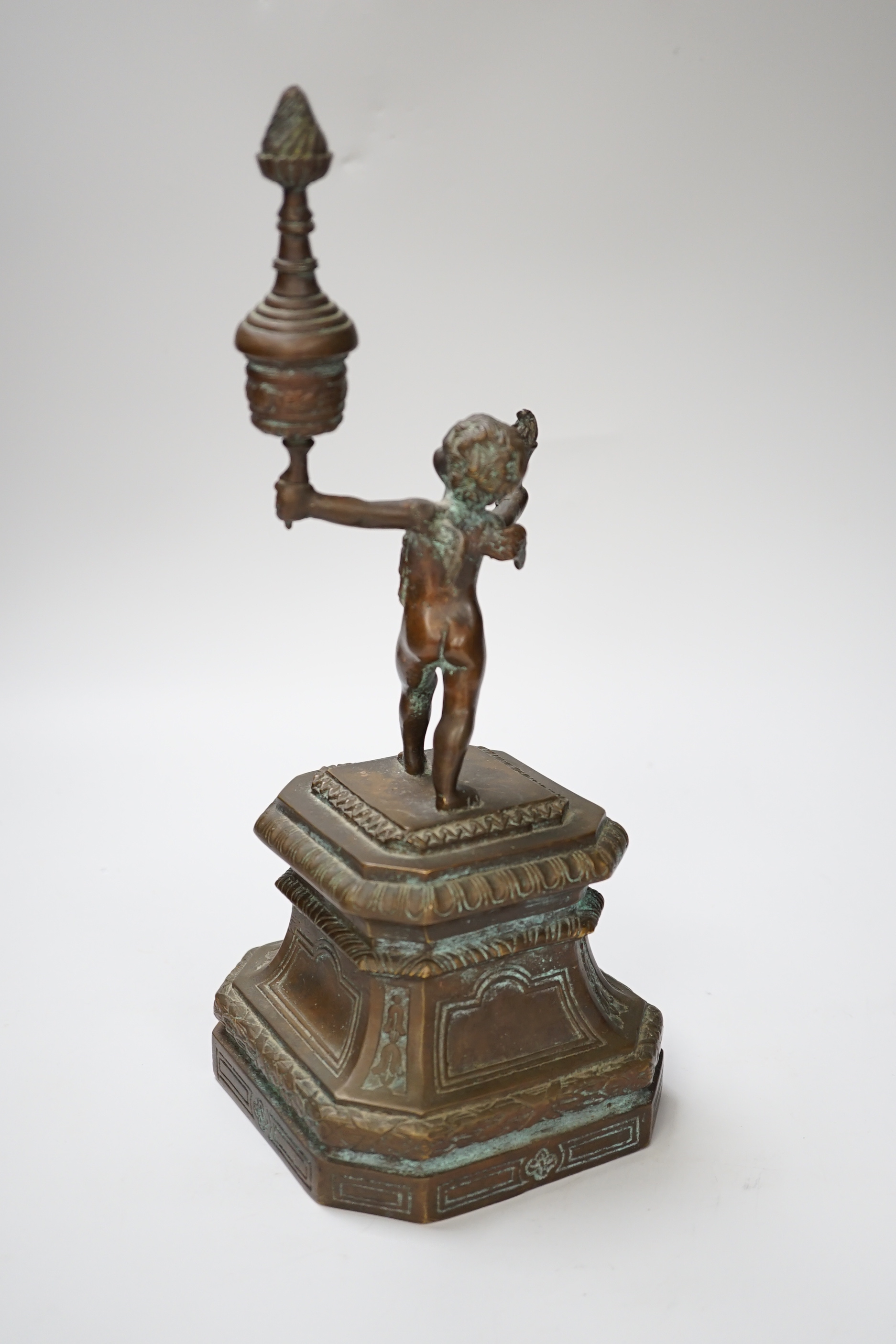 A bronze figure of a cherub, 30cm